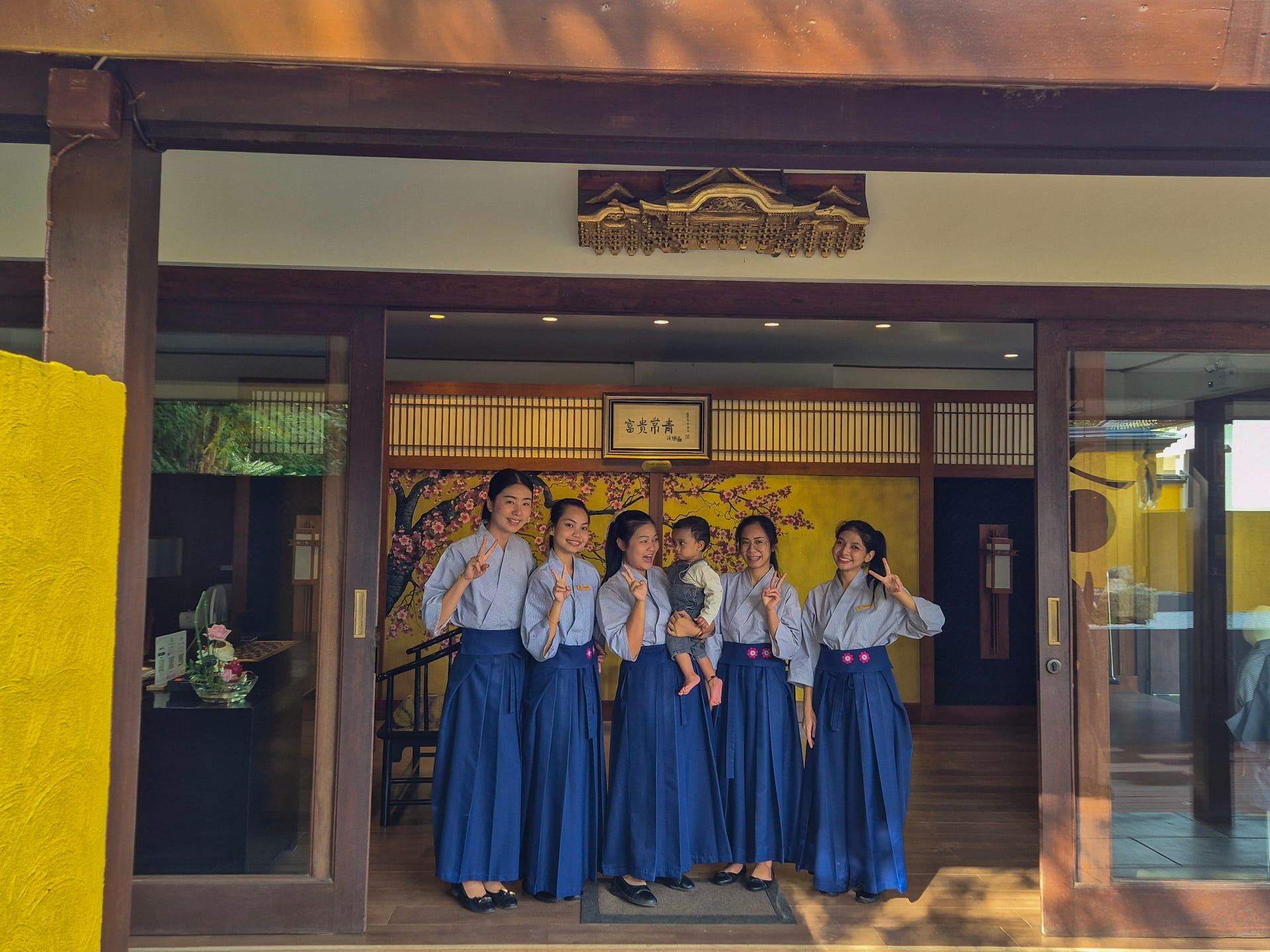 Onsen @ Moncham staff welcoming with baby